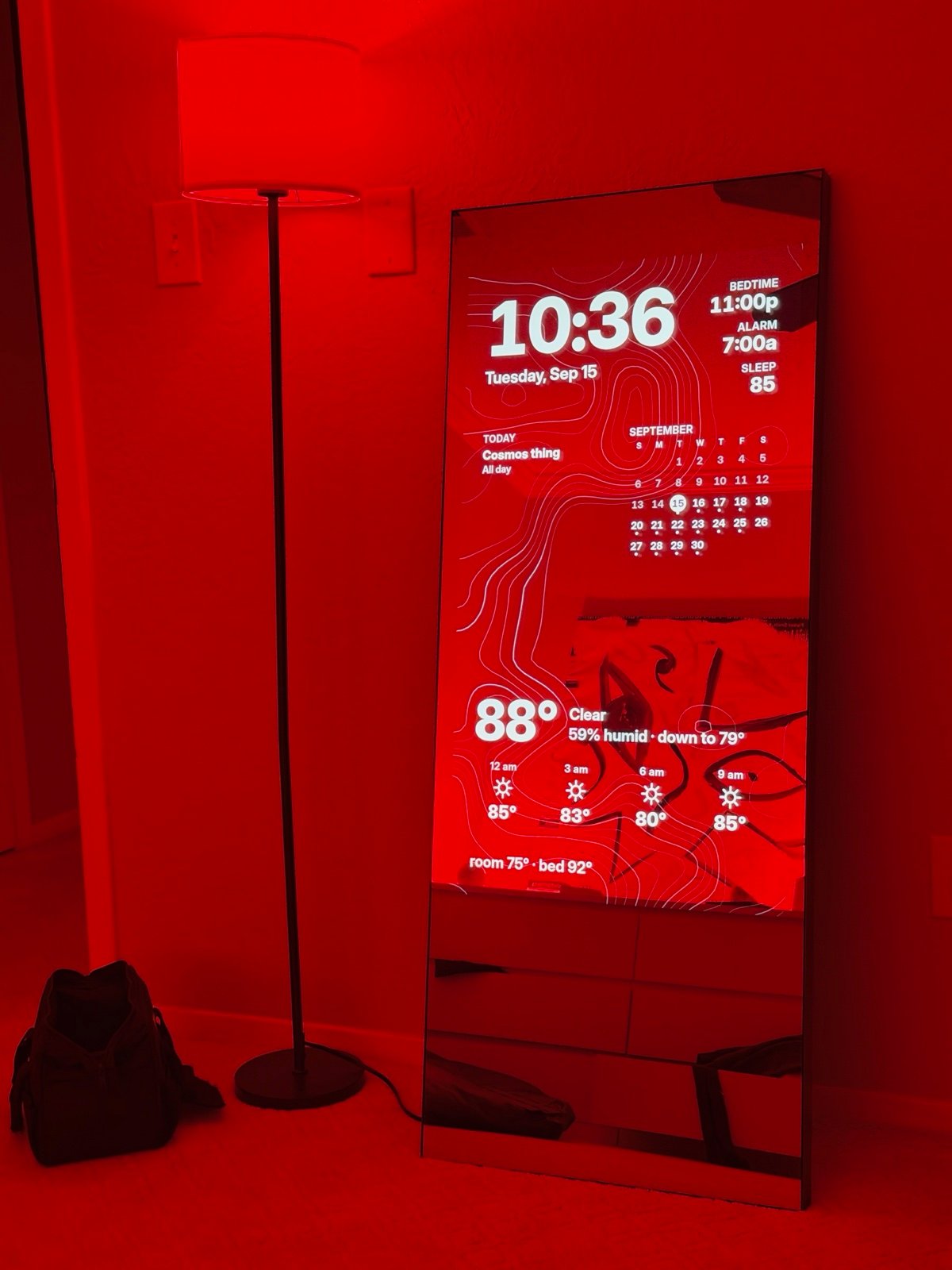 The mirror showing the clock, calendar, sleep plan, and weather